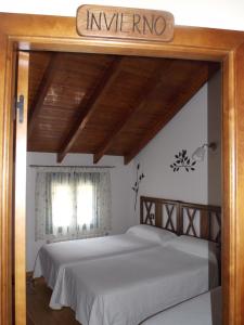 Postel nebo postele na pokoji v ubytování Hostal El Recanto