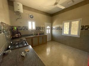 a kitchen with a counter and a stove in it at Apartment in Bayt Al Jabal شقة في بيت الجبل in Sayq