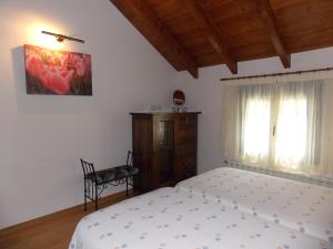 Postel nebo postele na pokoji v ubytování Hostal El Recanto