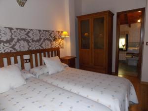 Postel nebo postele na pokoji v ubytování Hostal El Recanto