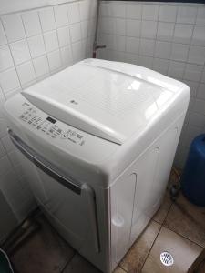 a white toaster sitting in a bathroom at Mi Casa in Quito