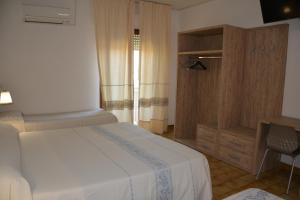 Postel nebo postele na pokoji v ubytování Hotel Citti