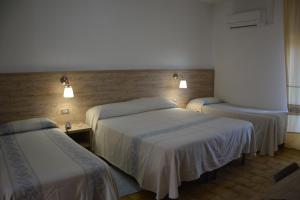 Postel nebo postele na pokoji v ubytování Hotel Citti
