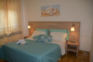 Postel nebo postele na pokoji v ubytování Hotel Citti