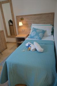 Postel nebo postele na pokoji v ubytování Hotel Citti