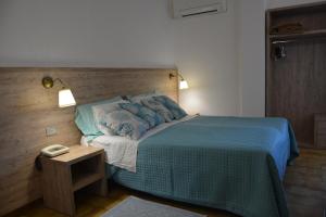 Postel nebo postele na pokoji v ubytování Hotel Citti