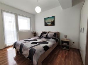 a bedroom with a large bed in a room at Charming & Spacious 2 Bedroom Apartment with a Gorgeous 8th-floor view in Ohrid