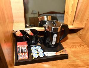a tray with two coffee mugs on a table at Fishermans Village with Sea Views in Downings