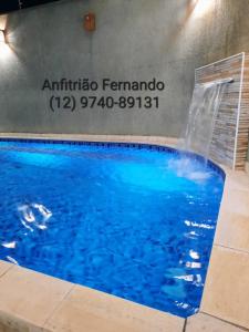 A piscina localizada em Hospedaria Litoral Caraguatatuba-SP ou nos arredores