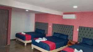 Postel nebo postele na pokoji v ubytování Hotel La Intimidad