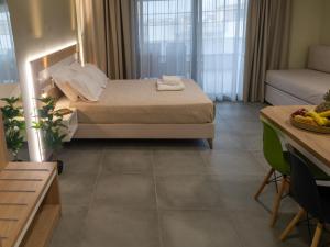 Кровать или кровати в номере Garden Apartments
