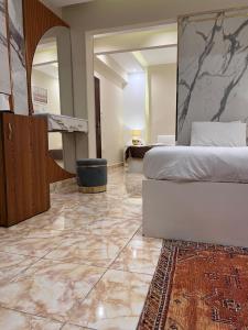 a hotel room with a bed and a mirror at Pyramids Top Inn in Cairo +133 photos