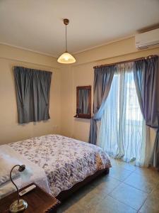 Posteľ alebo postele v izbe v ubytovaní Athevillas Chrysoula