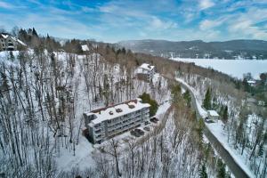 an aerial view of a building in the snow at Le Colvert by Rendez-Vous Mont-Tremblant in Mont-Tremblant