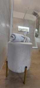 a white toilet in a bathroom with two towels at Sweet Home Simona in Zambrone +39 photos