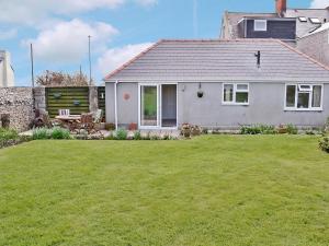 a house with a lawn in front of it at Freshwater Bay View in Southwell