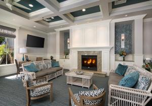 a living room with couches and a fireplace at Avila Lighthouse Suites in Avila Beach