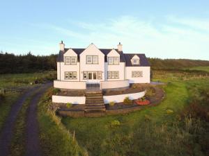an aerial view of a large white house at Knockinaam House in Colfin