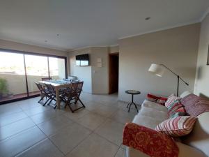 a living room with a couch and a table at La Maruca 631 in Balcarce
