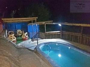 a swimming pool in the snow at night at Thula Du Estate - family houses in Mbabane