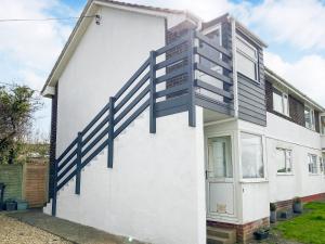 a house with a staircase on the side of it at Galleons Reach in Instow