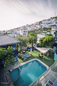 an image of a swimming pool in a house at Hôtel ZIRYAB in Chefchaouen