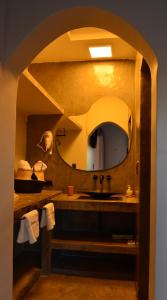 a bathroom with a sink and a mirror at WAYTAY in Cafayate