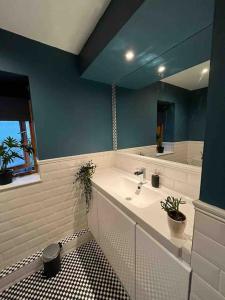 a bathroom with a sink and a mirror at Serene Riverside Villa - Hidden gem in Dublin City in Dublin