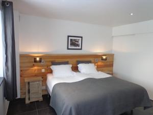 Postel nebo postele na pokoji v ubytování B&B Domaine du Vieux Chêne