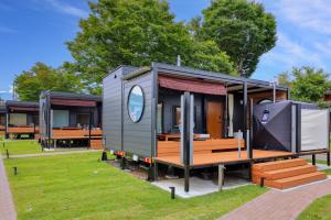 a tiny house on display in a park at Piilo asobi&stay in Yamanakako