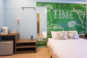 A bed or beds in a room at Bei Pin B&B