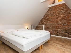 Katil atau katil-katil dalam bilik di Holiday home Tønder IV