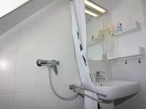 a bathroom with a shower and a sink at Doppelhaushälfte Lee in Zingst in Zingst +21 photos