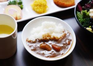 a bowl of food with rice and a cup of tea at APA Hotel TKP Keikyu Kawasaki Ekimae in Kawasaki +41 photos
