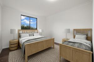 Postel nebo postele na pokoji v ubytování Alps Lakeview Lodge + 27 fotografií