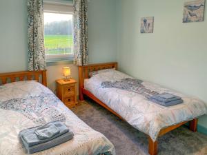 A bed or beds in a room at Ardwell Park
