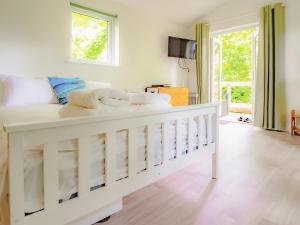 a bedroom with a white bed with towels on it at Owl - Uk43447 in Hayle