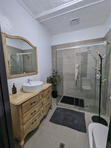 a bathroom with a sink and a shower at Toodyay Manor in Toodyay