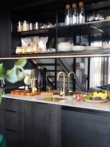 a kitchen with a sink and a counter top at Murdoch + Luxury + Experience in Lebrina