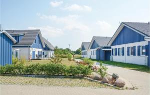 a row of houses with blue and white at Ferienhaus 15 Altefhr in Altefähr