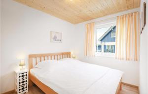 Ein Bett oder Betten in einem Zimmer der Unterkunft Ferienhaus 15 Altefähr