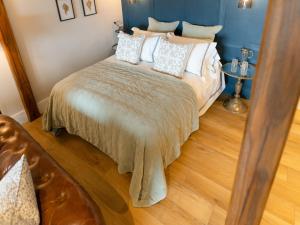 a bedroom with a bed with pillows on it at Rum Studio - Ukc6564 in Mallaig