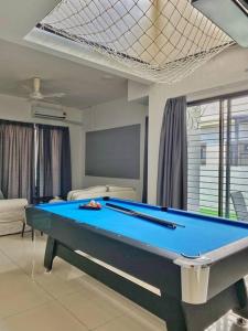 a living room with a pool table in it at Shah Alam Setia Alam SCCC 3 Storey Semi D 13 Pax in Shah Alam