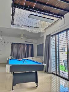 a room with a pool table in a room at Shah Alam Setia Alam SCCC 3 Storey Semi D 13 Pax in Shah Alam