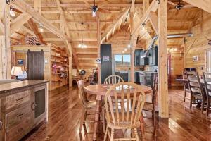 a kitchen and dining room with a table and chairs at Secluded Black Hills Cabin in Nemo