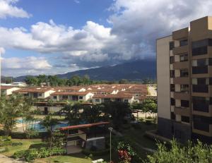 a view of a resort with a mountain in the background at Beautiful Apartment w/ Balcony Family Friendly in San Rafael