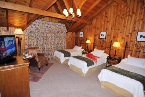 Cama ou camas em um quarto em Hotel Posada Los Alamos