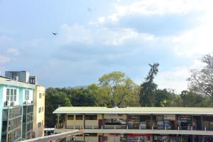 a building with a bird flying in the sky at Janara Two in Kurunegala