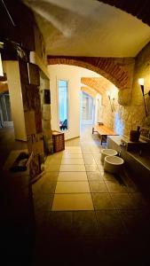 a room with two toilets in a stone building at Hotel Erbgericht in Bad Schandau