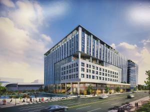 a rendering of a tall glass building with a street at Hotel Tour Incheon Airport Hotel & Suites in Incheon